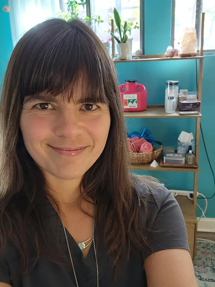Briana smiling in her treatment room
