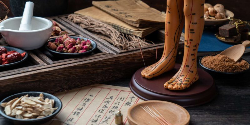 Acupuncture puppets and traditional Chinese medicine are on the table